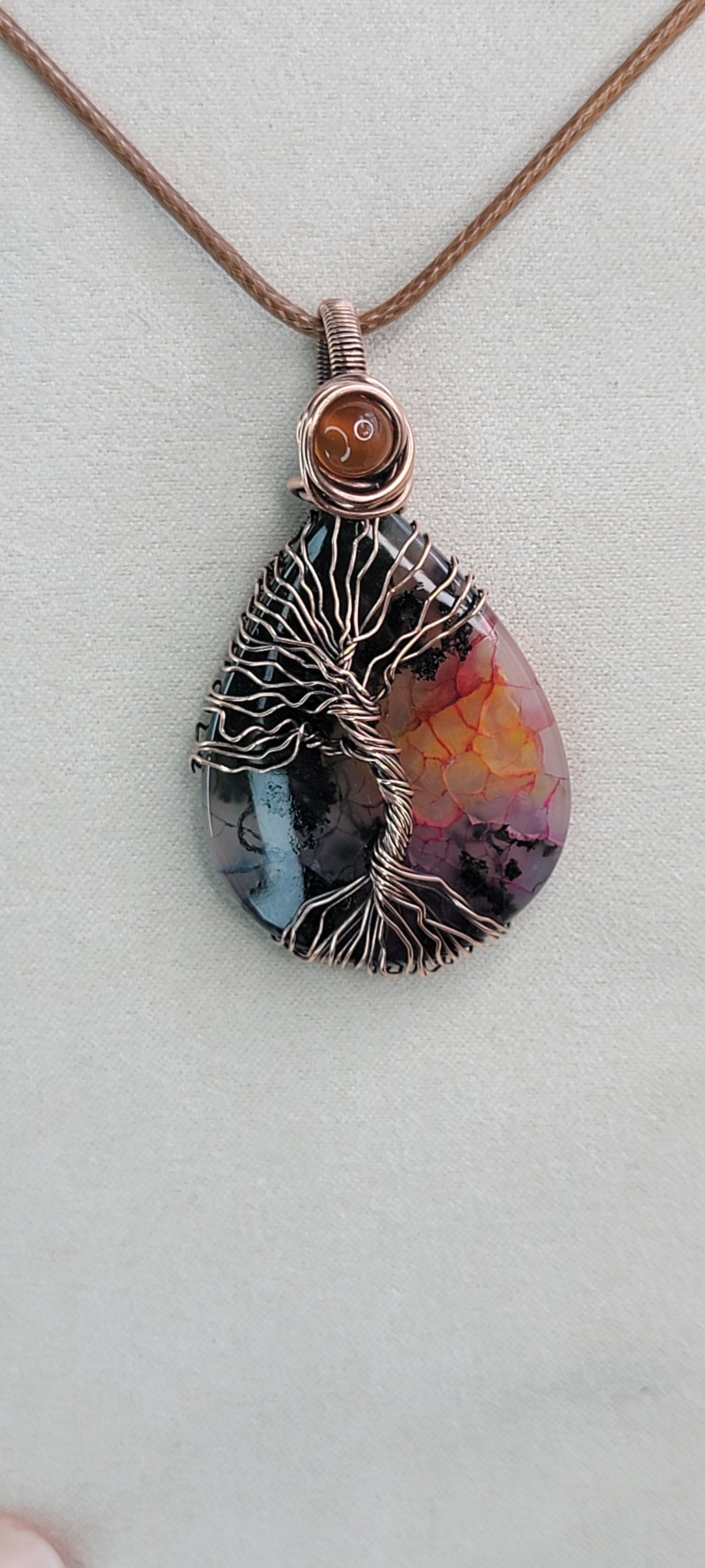 Garden Quartz ( dyed ) wrapped in copper, with carnelian accent