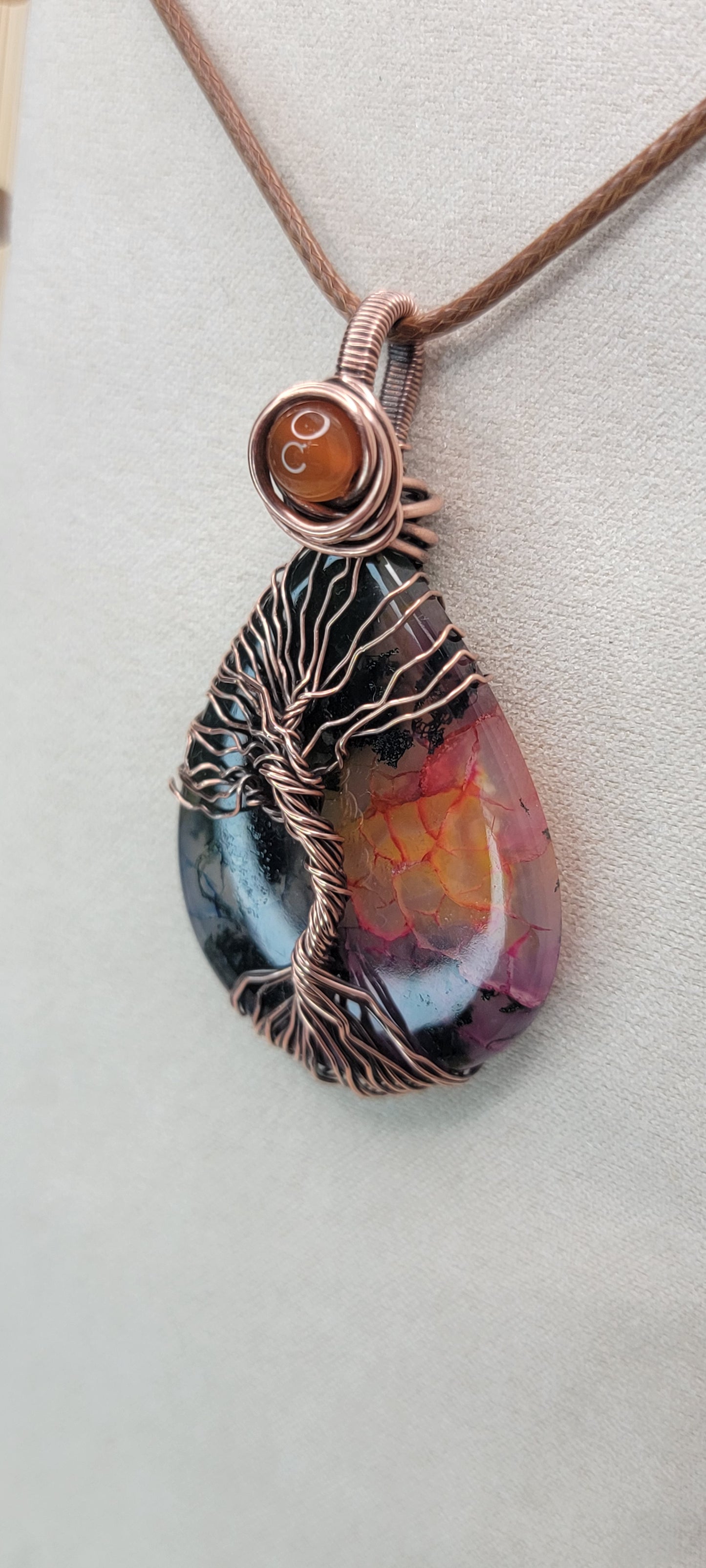 Garden Quartz ( dyed ) wrapped in copper, with carnelian accent